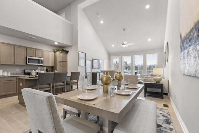 2215 Chase Dr Unit 102, Howell, MI 48855 - dining space featuring high vaulted ceiling, ceiling fan, light wood-style floors, recessed lighting, and baseboards