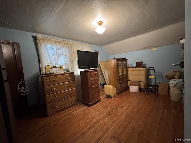 336 E Broad St, Lanse, MI 49946 - bedroom with hardwood / wood-style flooring and vaulted ceiling