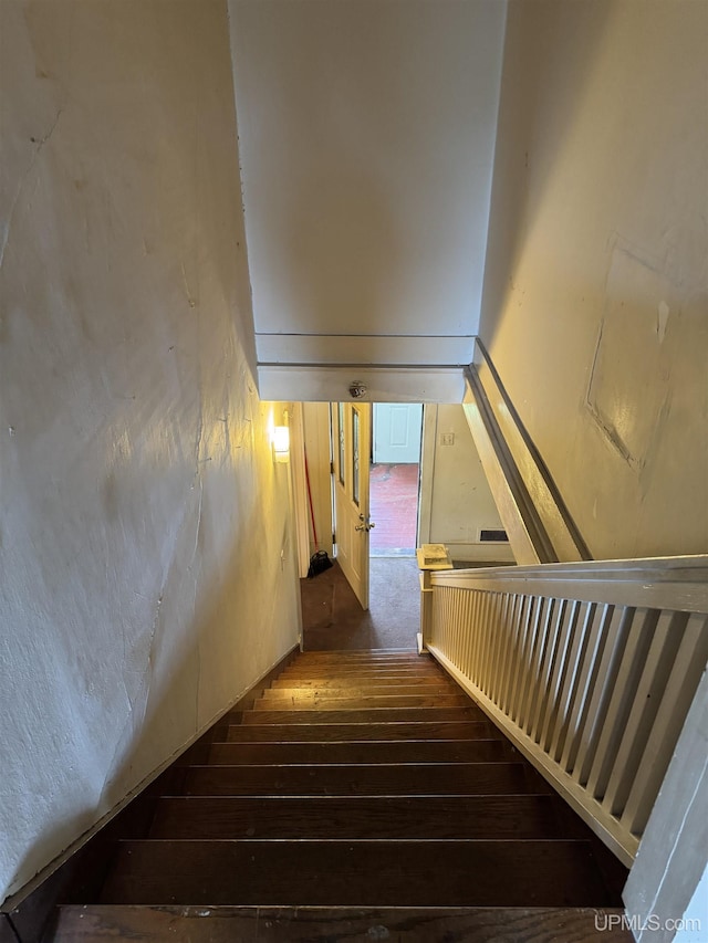 336 E Broad St, Lanse, MI 49946 - stairs featuring hardwood / wood-style floors