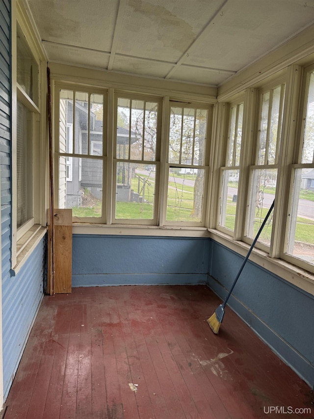 336 E Broad St, Lanse, MI 49946 - unfurnished sunroom with hardwood / wood-style flooring and baseboards