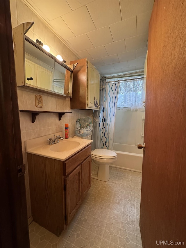 336 E Broad St, Lanse, MI 49946 - bathroom with vanity, shower / bath combination with curtain, toilet, and tile patterned floors