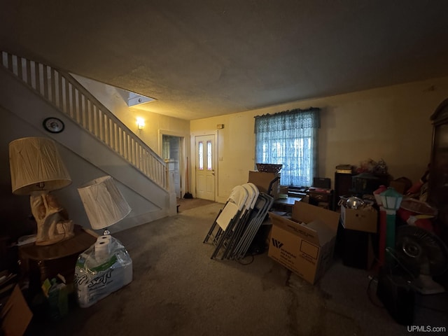 336 E Broad St, Lanse, MI 49946 - living room featuring stairs and carpet floors
