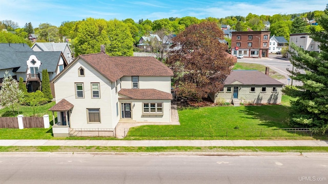 909 Quincy St, Hancock, MI 49930 - view of front of home with a residential view, a shingled roof, and entry steps