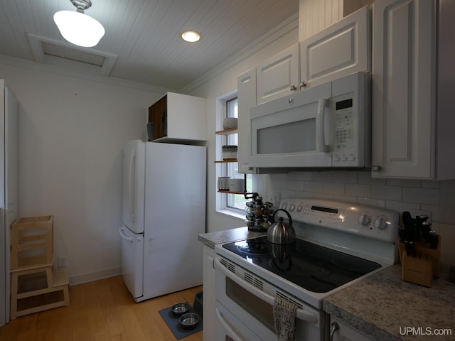 909 Quincy St, Hancock, MI 49930 - kitchen with white appliances, light wood-type flooring, crown molding, backsplash, and white cabinets