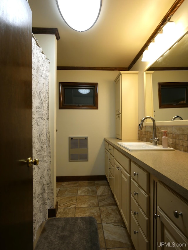909 Quincy St, Hancock, MI 49930 - full bathroom featuring crown molding, vanity, baseboards, decorative backsplash, and stone finish flooring