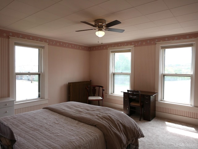909 Quincy St, Hancock, MI 49930 - bedroom featuring wallpapered walls, light carpet, and ceiling fan