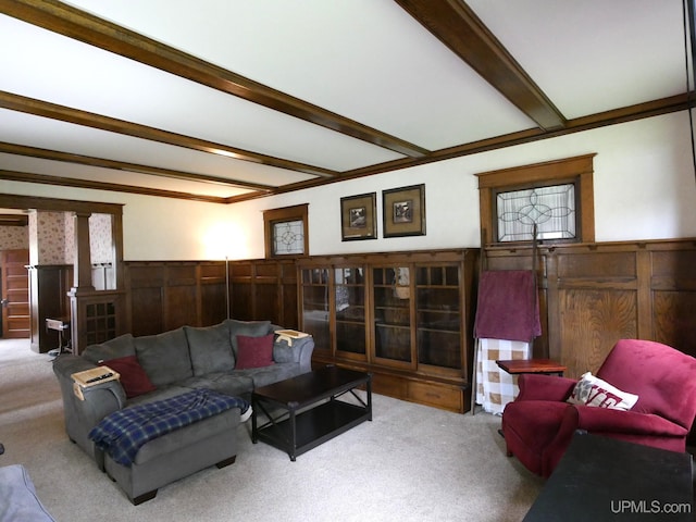 909 Quincy St, Hancock, MI 49930 - living room featuring carpet, wainscoting, beamed ceiling, plenty of natural light, and wooden walls