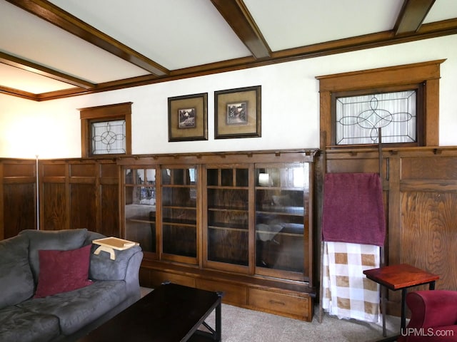 909 Quincy St, Hancock, MI 49930 - living area with beam ceiling and carpet