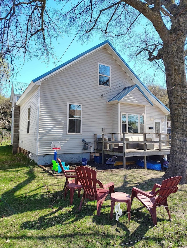 304 E Lincoln St, Negaunee, MI 49866 - rear view of property with a yard and a deck