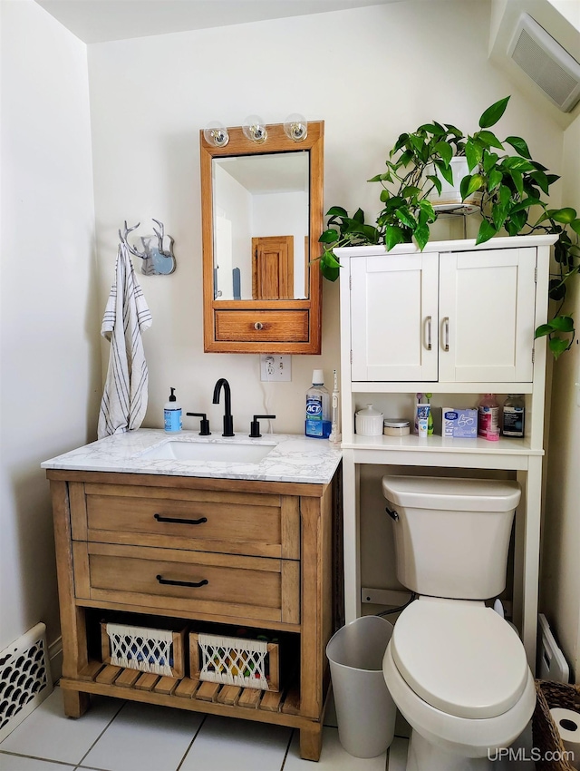 304 E Lincoln St, Negaunee, MI 49866 - half bathroom featuring vanity, toilet, and tile patterned flooring