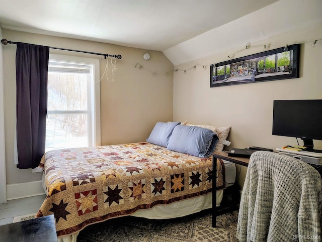 304 E Lincoln St, Negaunee, MI 49866 - bedroom with vaulted ceiling and baseboards