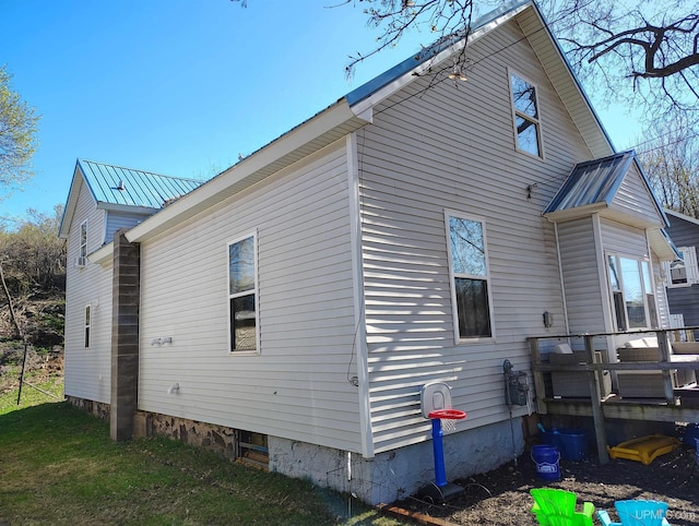 304 E Lincoln St, Negaunee, MI 49866 - view of side of property with metal roof