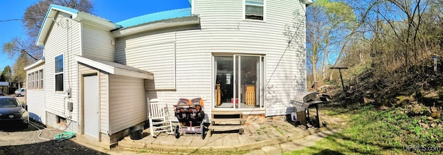304 E Lincoln St, Negaunee, MI 49866 - back of house featuring metal roof