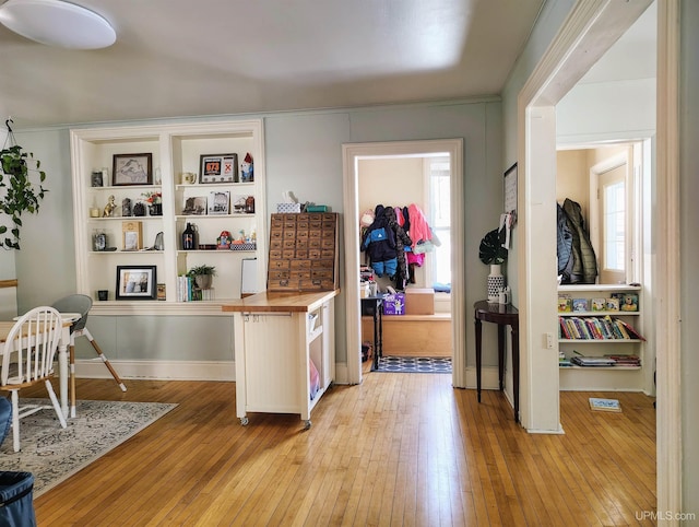304 E Lincoln St, Negaunee, MI 49866 - kitchen with light wood-style flooring, butcher block counters, and an office area