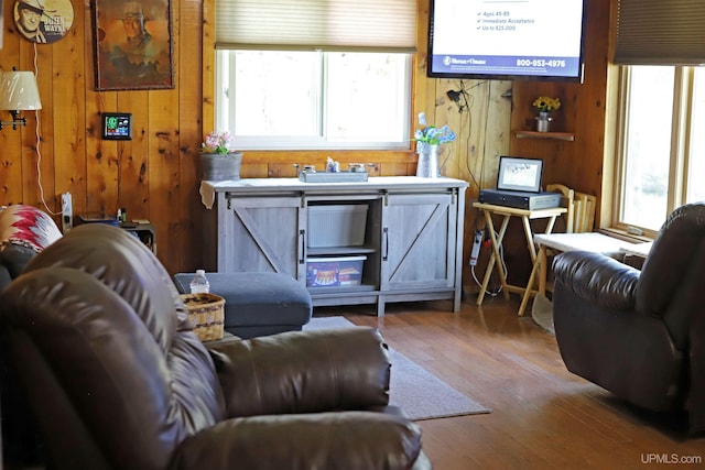 5631 County Road 550th Rd, Marquette, MI 49855 - living room featuring healthy amount of natural light, wood walls, and wood finished floors