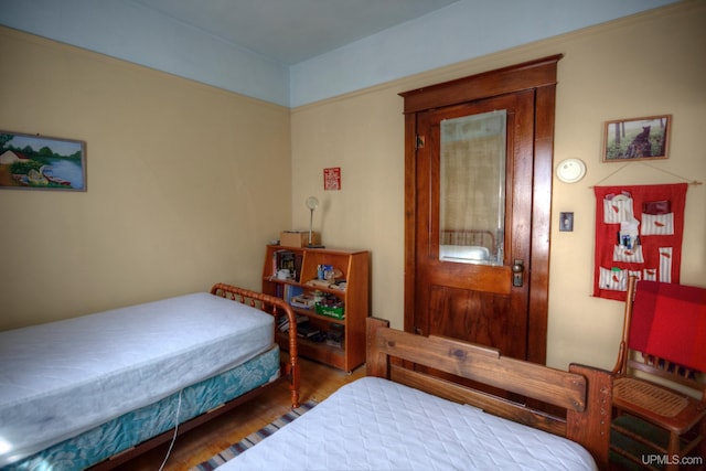 338 E Tamarack St, Ironwood, MI 49938 - bedroom featuring wood finished floors