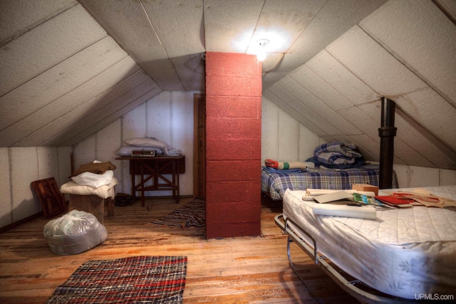 338 E Tamarack St, Ironwood, MI 49938 - bedroom with hardwood / wood-style flooring and lofted ceiling