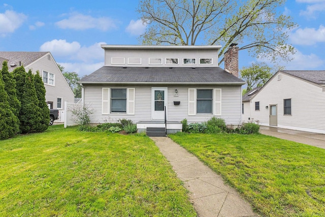 2678 Griffith Ave, Berkley, MI 48072 - view of front of house with a front yard and a chimney