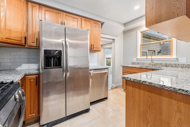 2678 Griffith Ave, Berkley, MI 48072 - kitchen featuring stainless steel appliances, light stone counters, backsplash, light tile patterned flooring, and recessed lighting