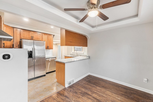 2678 Griffith Ave, Berkley, MI 48072 - kitchen with appliances with stainless steel finishes, a sink, a raised ceiling, ceiling fan, and light stone counters