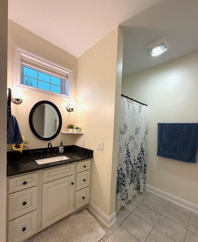 5266 Brook Hollow Ave, Bay City, MI 48706 - full bathroom with baseboards, vanity, tile patterned floors, and a shower with shower curtain
