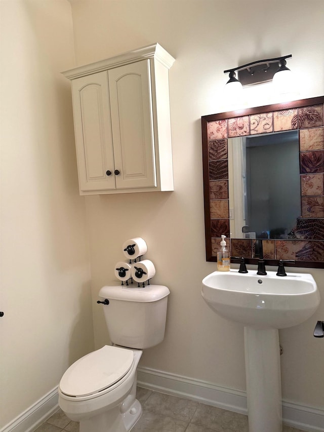 5266 Brook Hollow Ave, Bay City, MI 48706 - half bath featuring baseboards, toilet, and tile patterned flooring