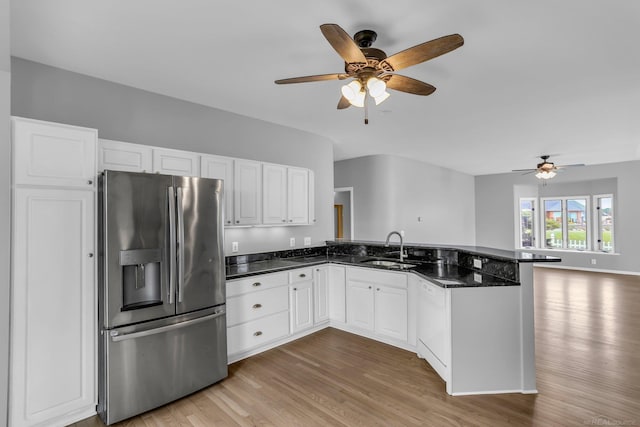 38340 Lakeshore Dr, Harrison Twp, MI 48045 - kitchen featuring stainless steel fridge, a sink, a peninsula, a ceiling fan, and light wood-style flooring