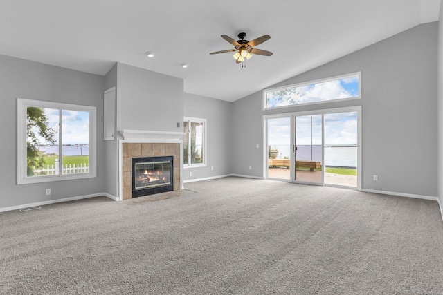 38340 Lakeshore Dr, Harrison Twp, MI 48045 - unfurnished living room featuring ceiling fan, a tile fireplace, carpet, baseboards, and high vaulted ceiling