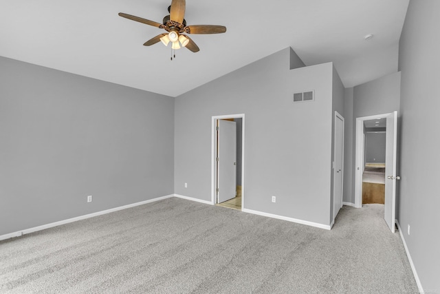 38340 Lakeshore Dr, Harrison Twp, MI 48045 - unfurnished bedroom featuring carpet flooring, baseboards, vaulted ceiling, and ceiling fan
