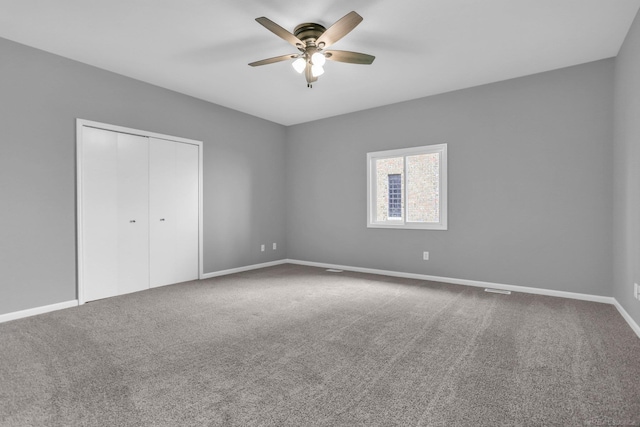 38340 Lakeshore Dr, Harrison Twp, MI 48045 - unfurnished bedroom with carpet, a closet, baseboards, and a ceiling fan