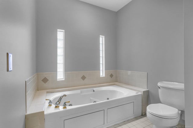 38340 Lakeshore Dr, Harrison Twp, MI 48045 - bathroom with a jetted tub, toilet, and tile patterned flooring