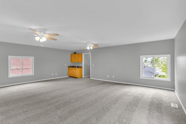38340 Lakeshore Dr, Harrison Twp, MI 48045 - unfurnished living room with ceiling fan, light carpet, and healthy amount of natural light