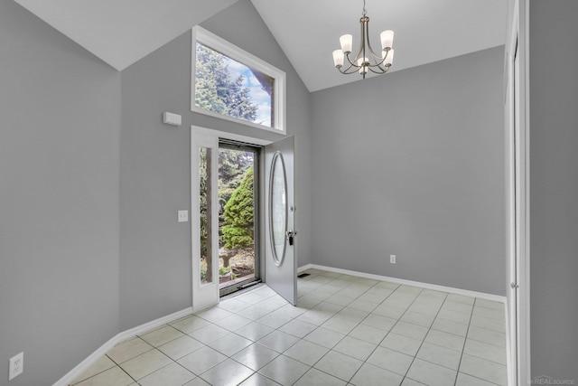 38340 Lakeshore Dr, Harrison Twp, MI 48045 - entrance foyer with high vaulted ceiling, a chandelier, light tile patterned floors, and baseboards