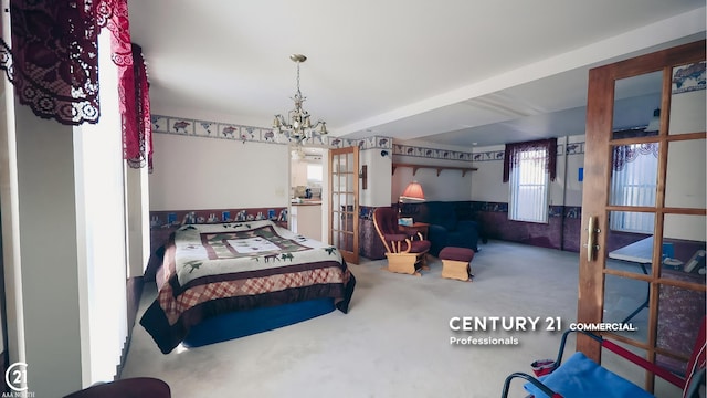2884 Fort St, Lincoln Park, MI 48146 - carpeted bedroom with french doors, a wainscoted wall, and a chandelier