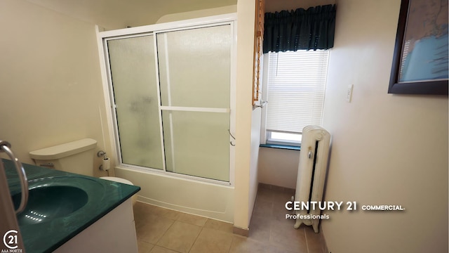 2884 Fort St, Lincoln Park, MI 48146 - bathroom with tile patterned floors, bath / shower combo with glass door, healthy amount of natural light, and radiator heating unit