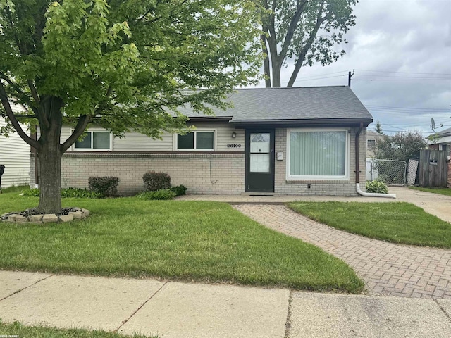 26100 Kathy St, Roseville, MI 48066 - view of front of house with brick siding, a gate, and a shingled roof