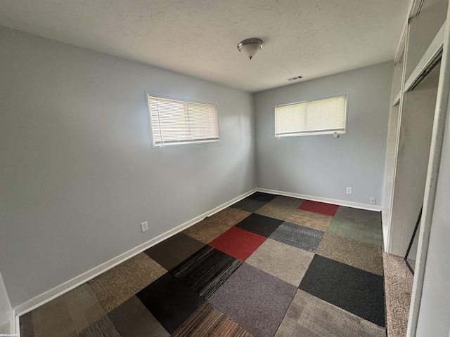 26100 Kathy St, Roseville, MI 48066 - unfurnished bedroom featuring a textured ceiling
