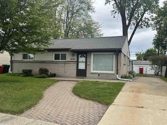 26100 Kathy St, Roseville, MI 48066 - single story home featuring brick siding, roof with shingles, a chimney, and concrete driveway