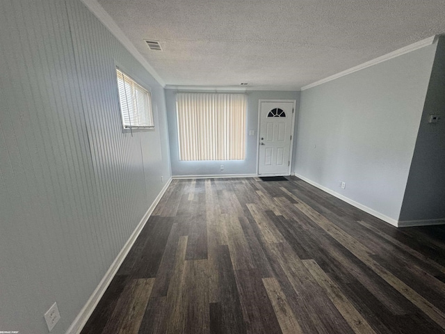 26100 Kathy St, Roseville, MI 48066 - empty room featuring ornamental molding, dark wood finished floors, baseboards, and a textured ceiling