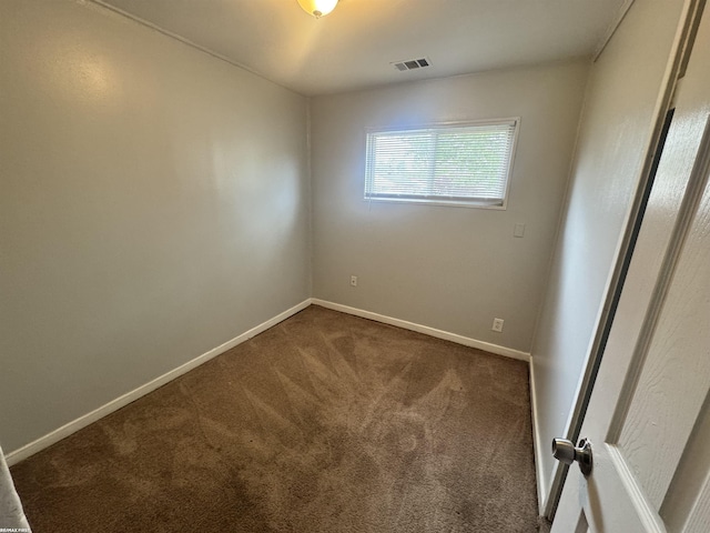 26100 Kathy St, Roseville, MI 48066 - spare room featuring dark carpet and baseboards
