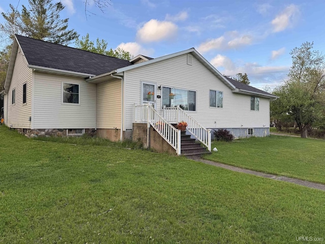 500 Fairbanks St, Iron Mountain, MI 49801 - back of house featuring a yard and roof with shingles