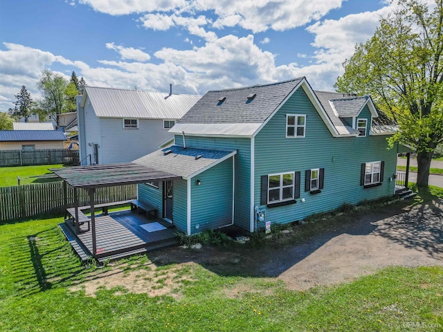 422 Washington St, Ishpeming, MI 49849 - rear view of house featuring a wooden deck and roof with shingles