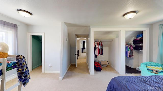 422 Washington St, Ishpeming, MI 49849 - bedroom featuring baseboards, light colored carpet, and a textured ceiling