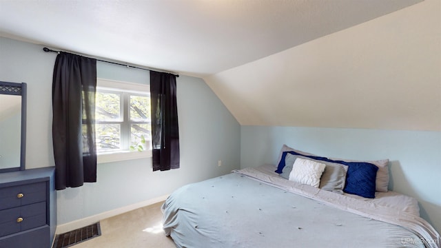 422 Washington St, Ishpeming, MI 49849 - carpeted bedroom featuring vaulted ceiling and baseboards