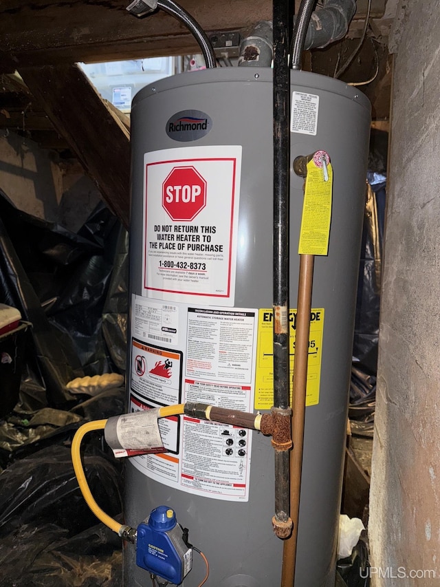 422 Washington St, Ishpeming, MI 49849 - utility room featuring water heater
