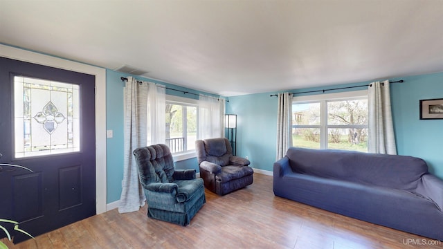 422 Washington St, Ishpeming, MI 49849 - living room featuring wood finished floors and baseboards
