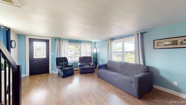422 Washington St, Ishpeming, MI 49849 - living room featuring wood finished floors and baseboards