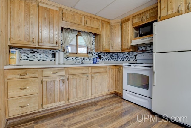 1782 H Rd, Bark River, MI 49807 - kitchen featuring white appliances, under cabinet range hood, light countertops, decorative backsplash, and light brown cabinetry