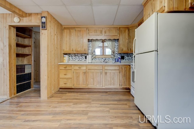 1782 H Rd, Bark River, MI 49807 - kitchen featuring freestanding refrigerator, light brown cabinets, light countertops, a drop ceiling, and wooden walls