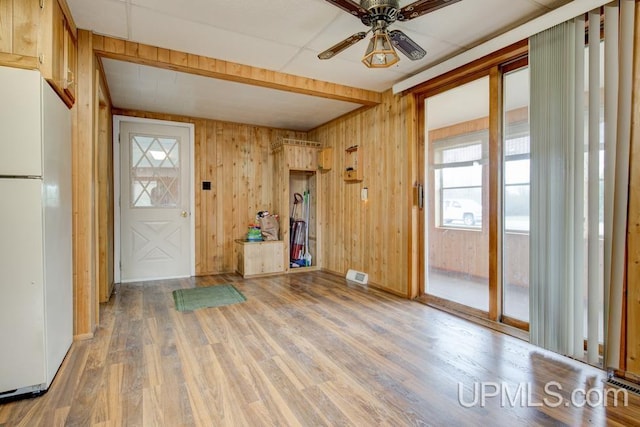 1782 H Rd, Bark River, MI 49807 - entryway with wood finished floors, a ceiling fan, wood walls, and baseboards